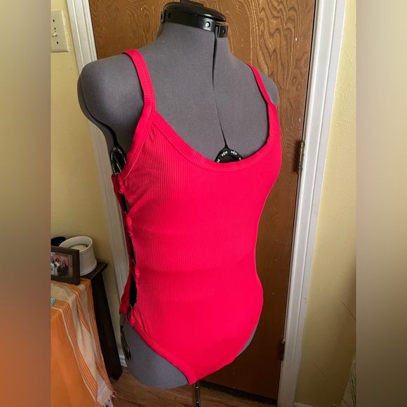 Other - Red one piece with cutout details on side. No boundaries, size large.